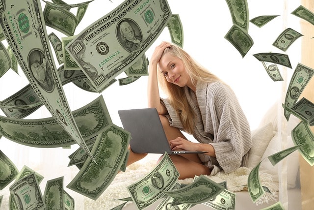 woman with laptop making money